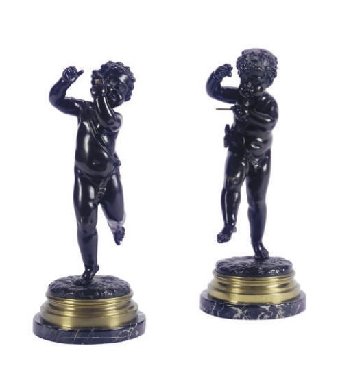 A PAIR OF PATINATED BRONZE MUSICAL PUTTI,