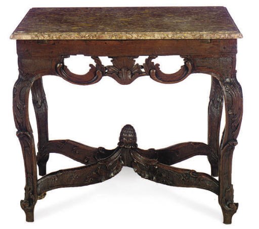 A CONTINENTAL CARVED OAK AND BRECHE VIOLETTE CENTER TABLE