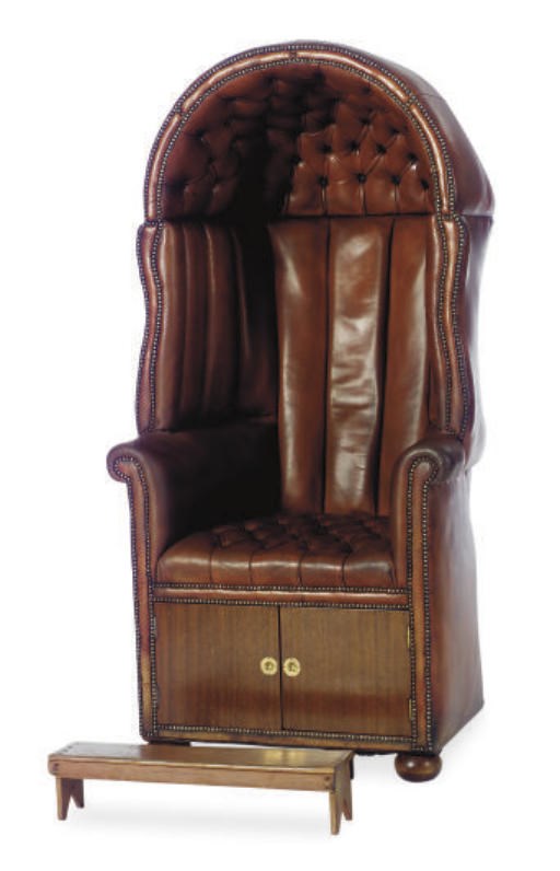 AN ENGLISH MAHOGANY AND BUTTON-TUFTED LEATHER PORTER'S CHAIR,