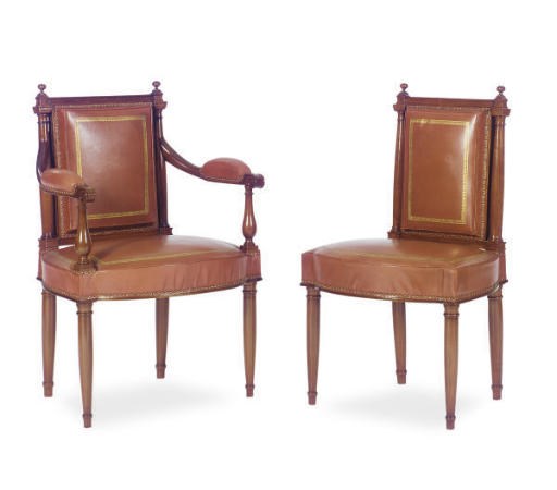A SET OF TWELVE CONTINENTAL WALNUT AND LEATHER UPHOLSTERED DINING CHAIRS,