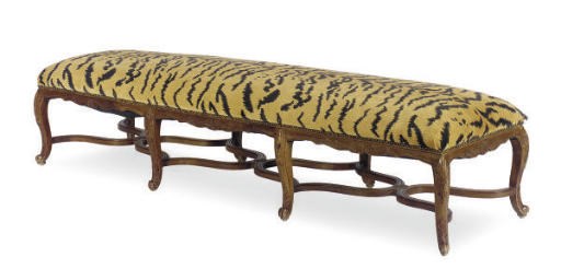 A WALNUT AND UPHOLSTERED BENCH,
