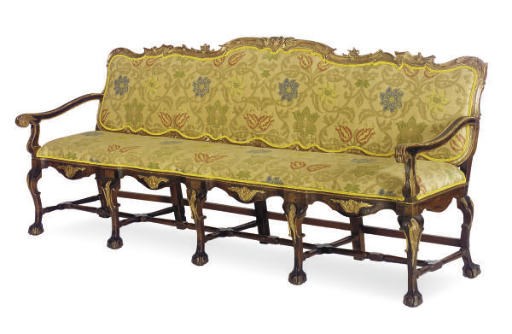 A PORTUGUESE WALNUT AND PARCEL-GILT SETTEE,