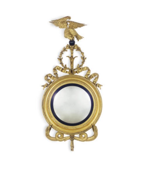 A PAIR OF ENGLISH GILTWOOD AND PART-EBONIZED FIGURAL CONVEX MIRRORS,
