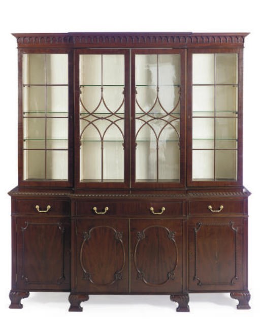 AN ENGLISH MAHOGANY BREAKFRONT BOOKCASE,