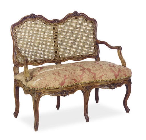 A LOUIS XV WALNUT SERPENTINE SETTEE,