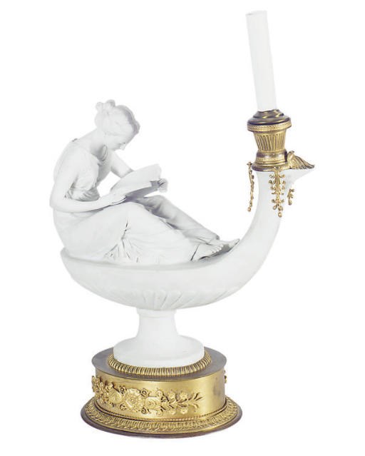 AN ORMOLU-MOUNTED CONTINENTAL BISCUIT PORCELAIN FIGURE OF A MUSE SEATED ON AN OIL LAMP READING,