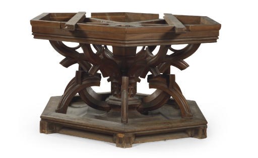 AN AUSTRIAN WALNUT EXTENDING DINING TABLE