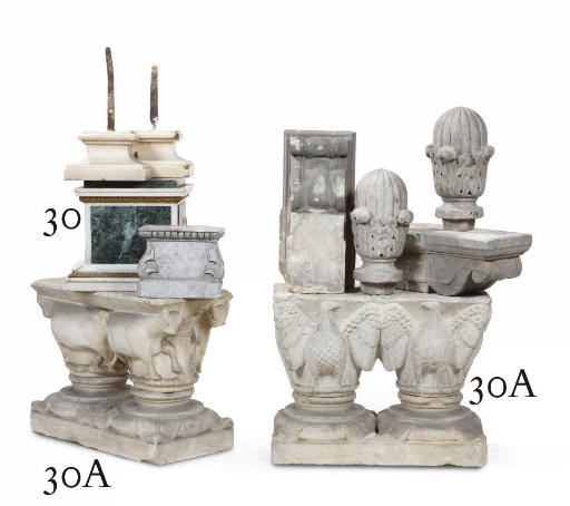 A PAIR OF ROMANESQUE CARVED WHITE MARBLE CAPITALS SHAPED AS BULLS AND EAGLES