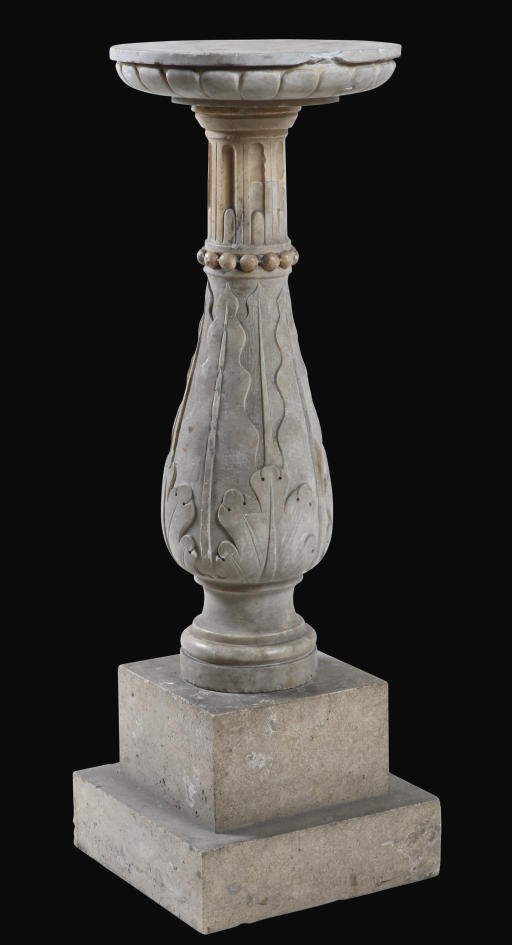 AN ITALIAN CARVED MARBLE PEDESTAL
