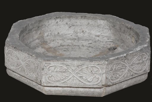 AN ITALIAN CARVED STONE OCTAGONAL BASIN