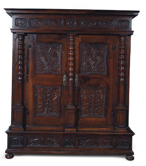 AN AUSTRIAN IRON-MOUNTED STAINED WALNUT CUPBOARD