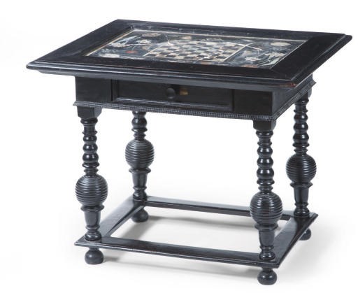 A SOUTH GERMAN EBONIZED AND SCAGLIOLA GAMES TABLE