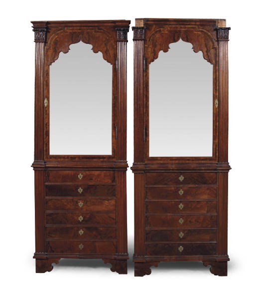 A PAIR OF AUSTRIAN WALNUT CORNER CABINETS