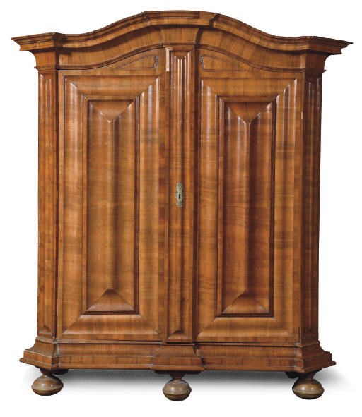 A BRASS-MOUNTED WALNUT CUPBOARD 'WELLENSCHRANK'