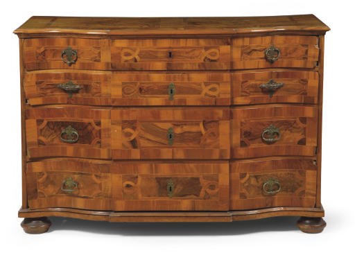 AN AUSTRIAN BRASS-MOUNTED WALNUT AND FRUITWOOD COMMODE