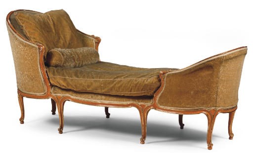 AN AUSTRIAN PARCEL-GILT AND GRAINED CARVED DAY-BED