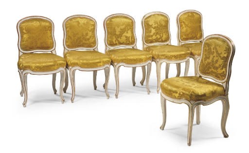 A SET OF SIX AUSTRIAN PARCEL-GILT AND WHITE-PAINTED CHAIRS
