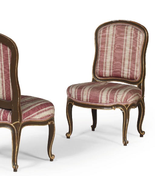 A SET OF SIX AUSTRIAN PARCEL-GILT AND BROWN-PAINTED CHAIRS