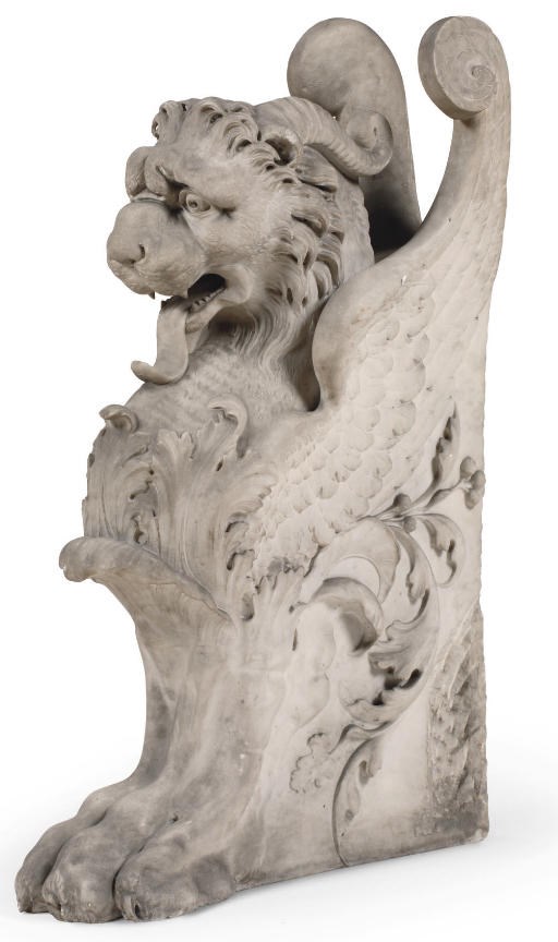 AN ITALIAN CARVED WHITE MARBLE GRIFFIN
