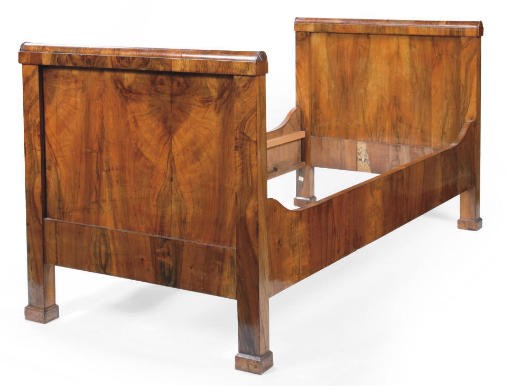 AN AUSTRIAN BIEDERMEIER FIGURED WALNUT BED