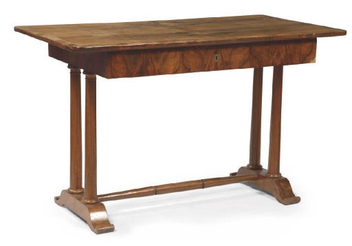 AN AUSTRIAN BIEDERMEIER WALNUT WRITING-TABLE