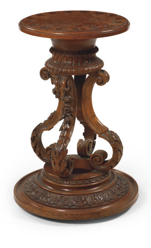 AN AUSTRIAN CARVED OAK CUE STAND