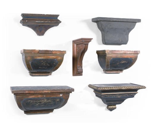 A SET OF FOUR CARVED OAK WALL BRACKETS