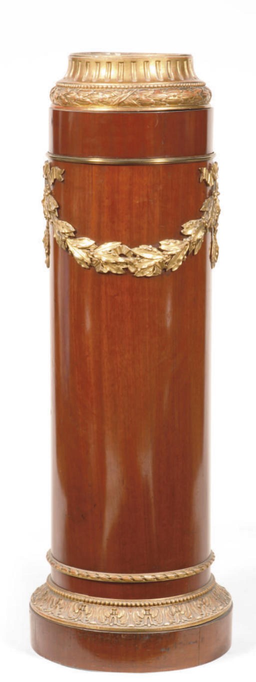 AN AUSTRIAN GILT-METAL MOUNTED, CARVED GILTWOOD AND MAHOGANY PEDESTAL