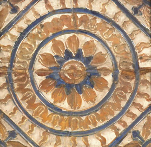 TWO HISPANO-MORESQUE GLAZED EARTHENWARE 'CUERDA SECA' TILES