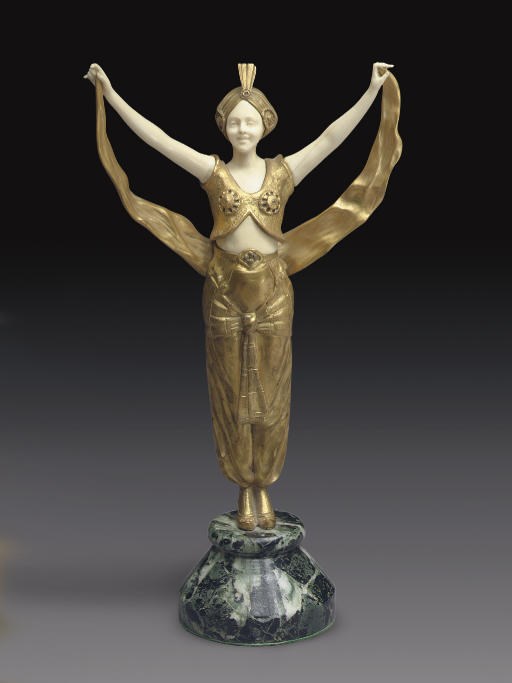 A FRENCH GILT-BRONZE AND IVORY FIGURE OF A MOORISH DANCER**