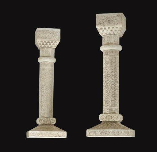 A PAIR OF CARVED MARBLE PEDESTALS