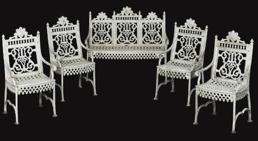 A WHITE-PAINTED CAST-IRON FIVE-PIECE SUITE OF GARDEN FURNITURE