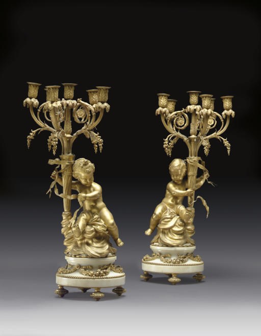 A PAIR OF FRENCH ORMOLU AND WHITE MARBLE SIX-LIGHT CANDELABRA