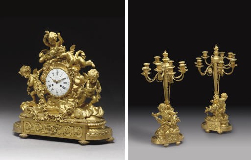 A NAPOLEON III ORMOLU THREE-PIECE CLOCK GARNITURE