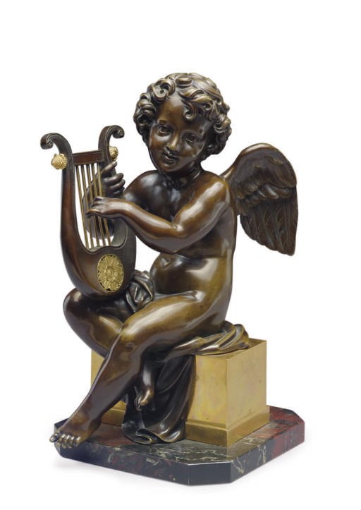 A FRENCH PATINATED AND GILT-BRONZE FIGURE OF A PUTTO