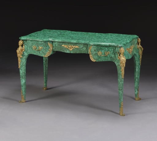 A FRENCH ORMOLU-MOUNTED MALACHITE-VENEERED BUREAU PLAT