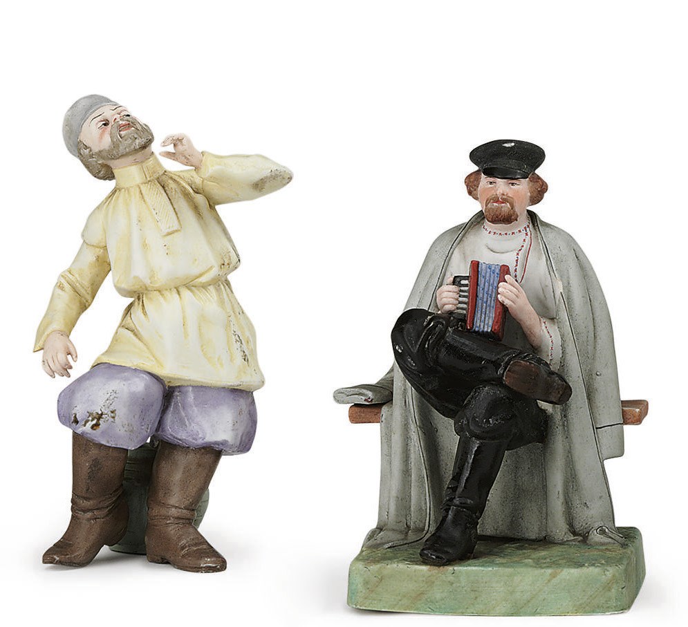 A Porcelain Figure of an Accordion Player and a Figure of a Peasant Dancing