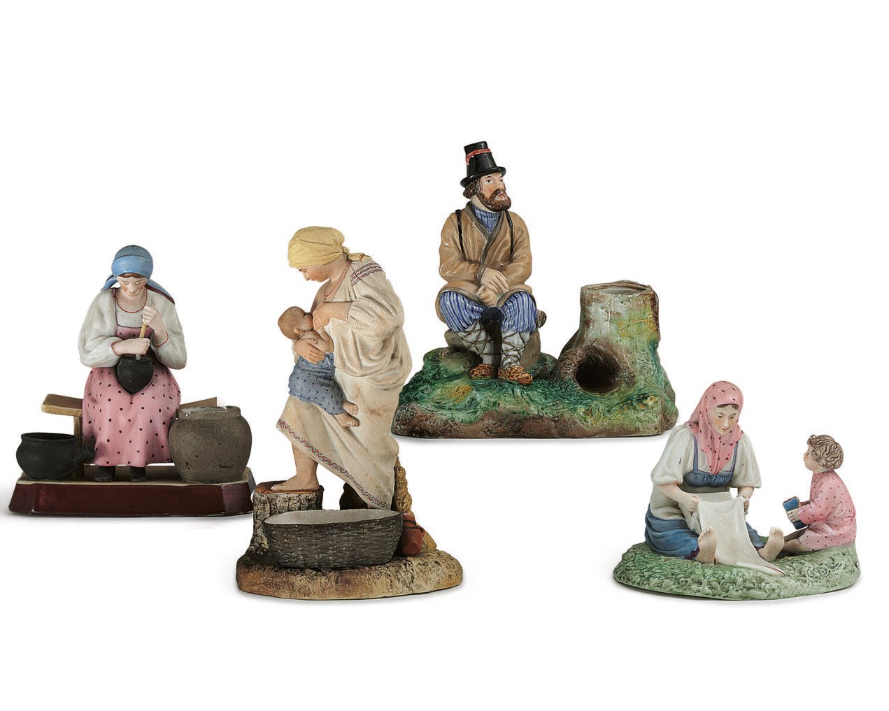 A Porcelain Group of a Woman Nursing a Child and Three Other Figures