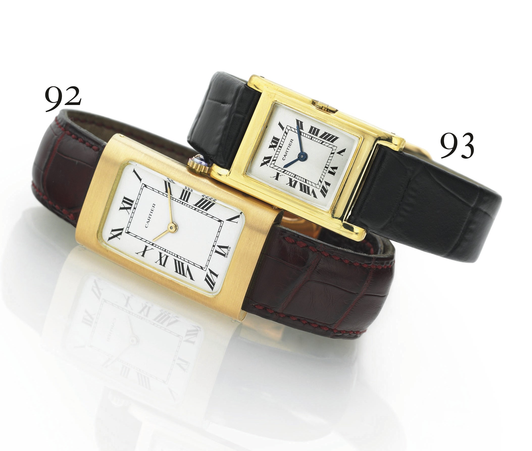 CARTIER. AN OVERSIZED 18K GOLD CURVED RECTANGULAR WRISTWATCH WITH CONCEALED LUGS