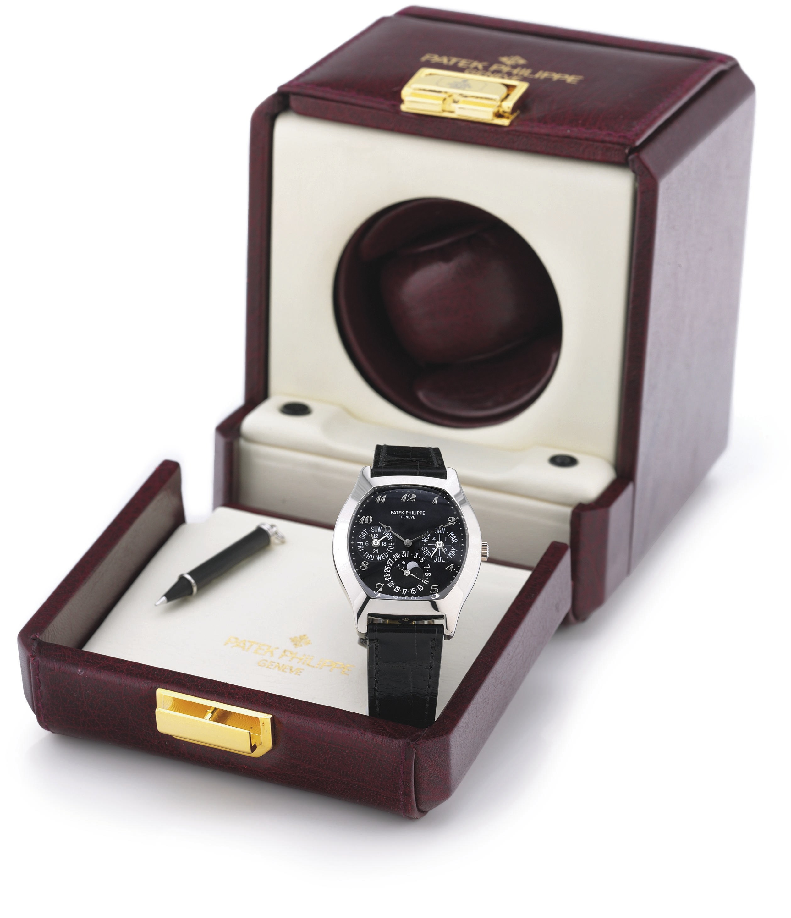 PATEK PHILIPPE. A FINE AND RARE 18K WHITE GOLD TONNEAU AUTOMATIC PERPETUAL CALENDAR WRISTWATCH WITH MOON PHASES, BLACK DIAL AND BREGUET NUMERALS