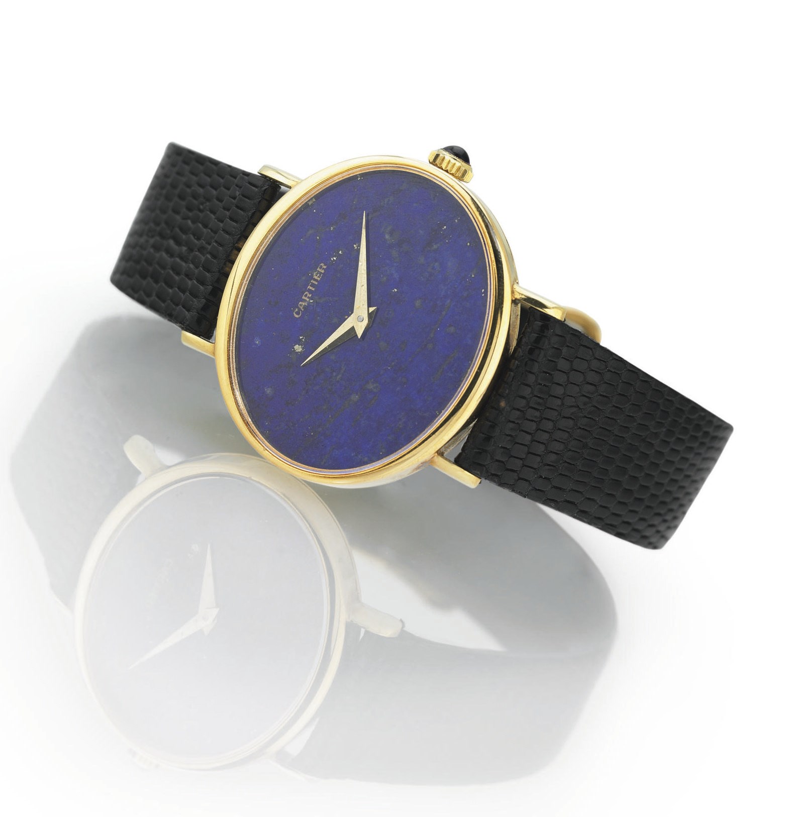 BAUME & MERCIER. AN 18K GOLD AND LAPIS LAZULI OVAL WRISTWATCH