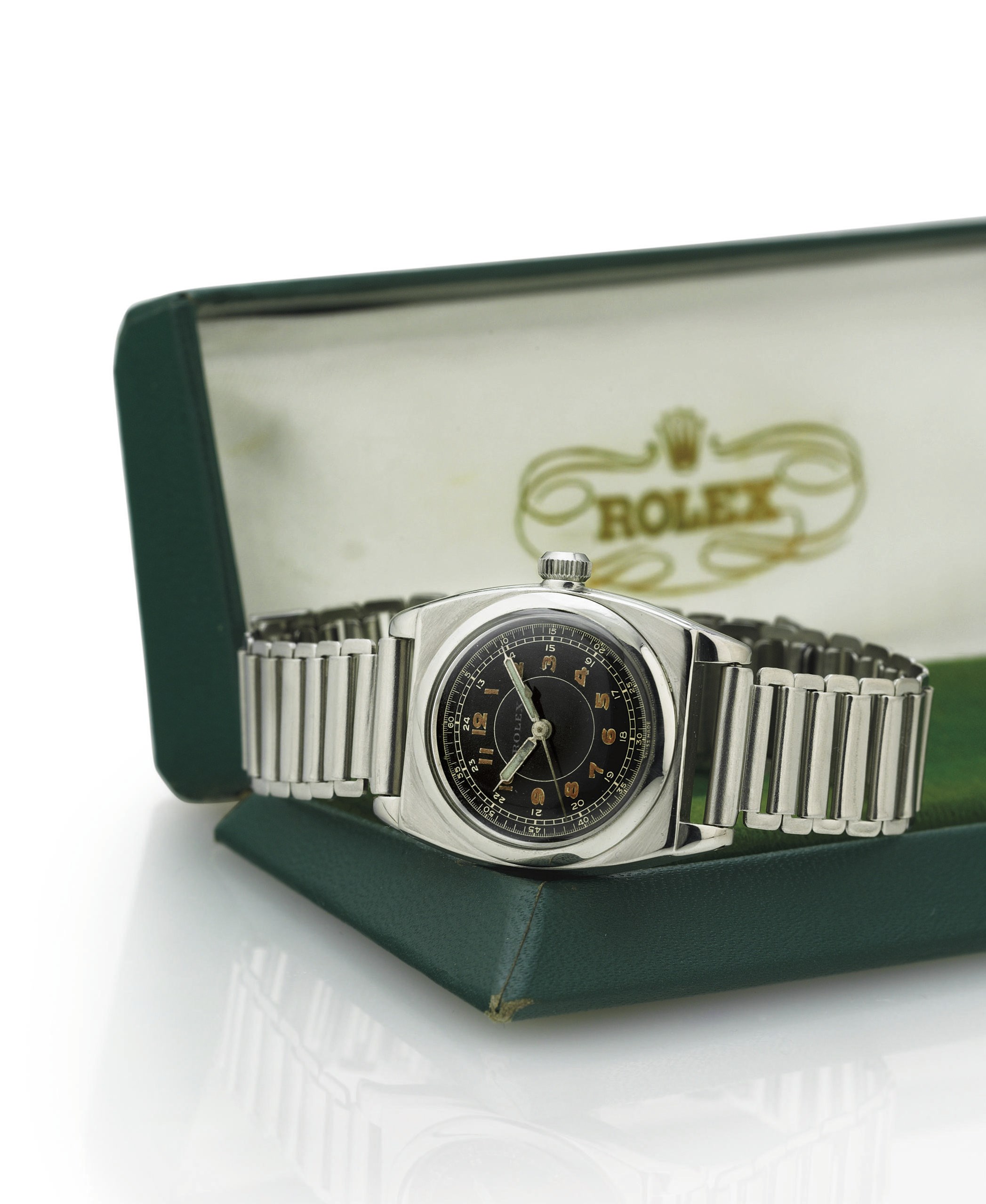 ROLEX.  A RARE STAINLESS STEEL TONNEAU WRISTWATCH WITH CENTER SECONDS AND BLACK DIAL