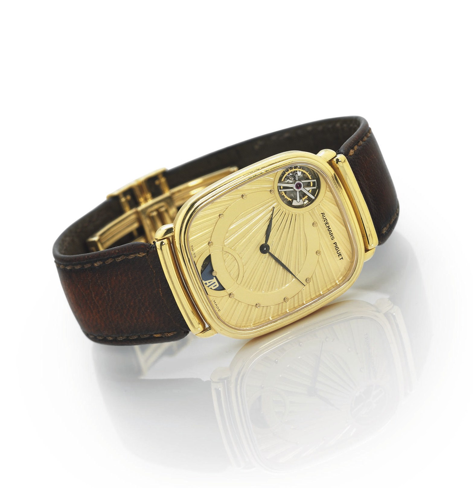 AUDEMARS PIGUET. A RARE SLIM 18K GOLD CUSHION AUTOMATIC TOURBILLON WRISTWATCH