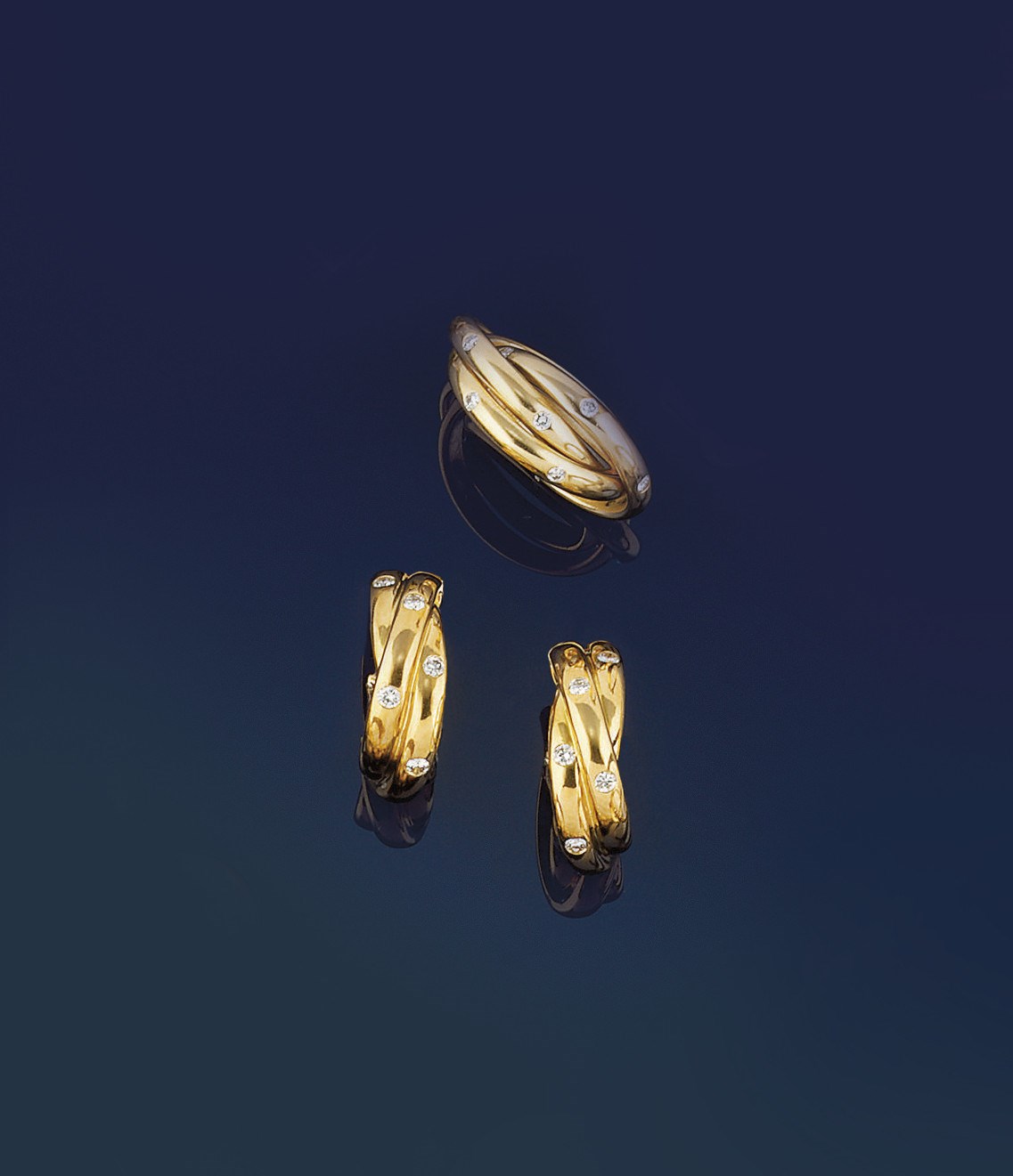 A pair of diamond hoop earrings and matching ring, by Cartier