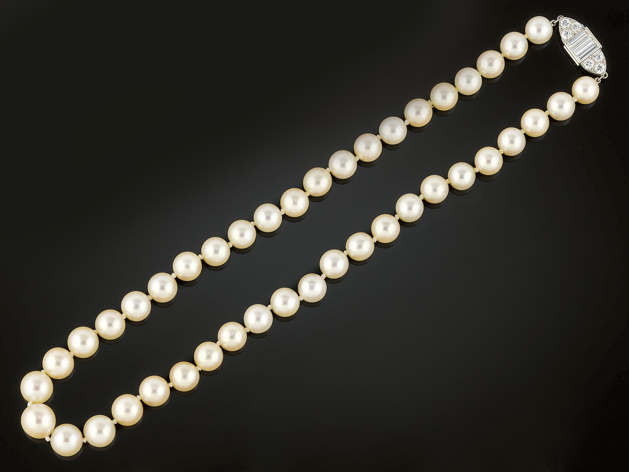 A cultured pearl neckace on a diamond clasp by Van Cleef & Arpels