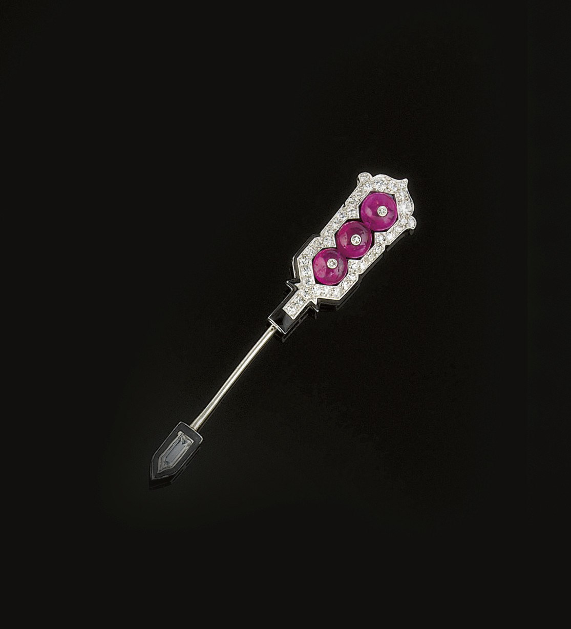 An Art Deco ruby, diamond and enamel sureté pin