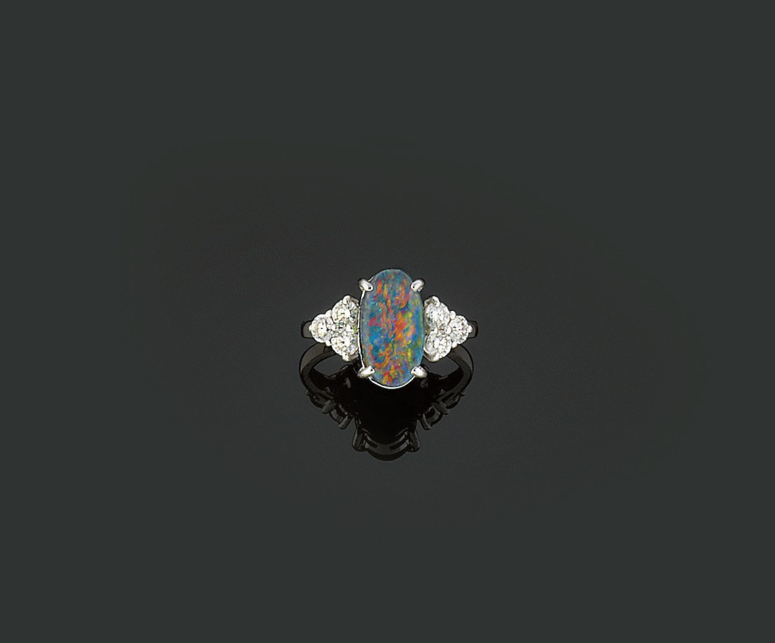 A black opal and diamond ring