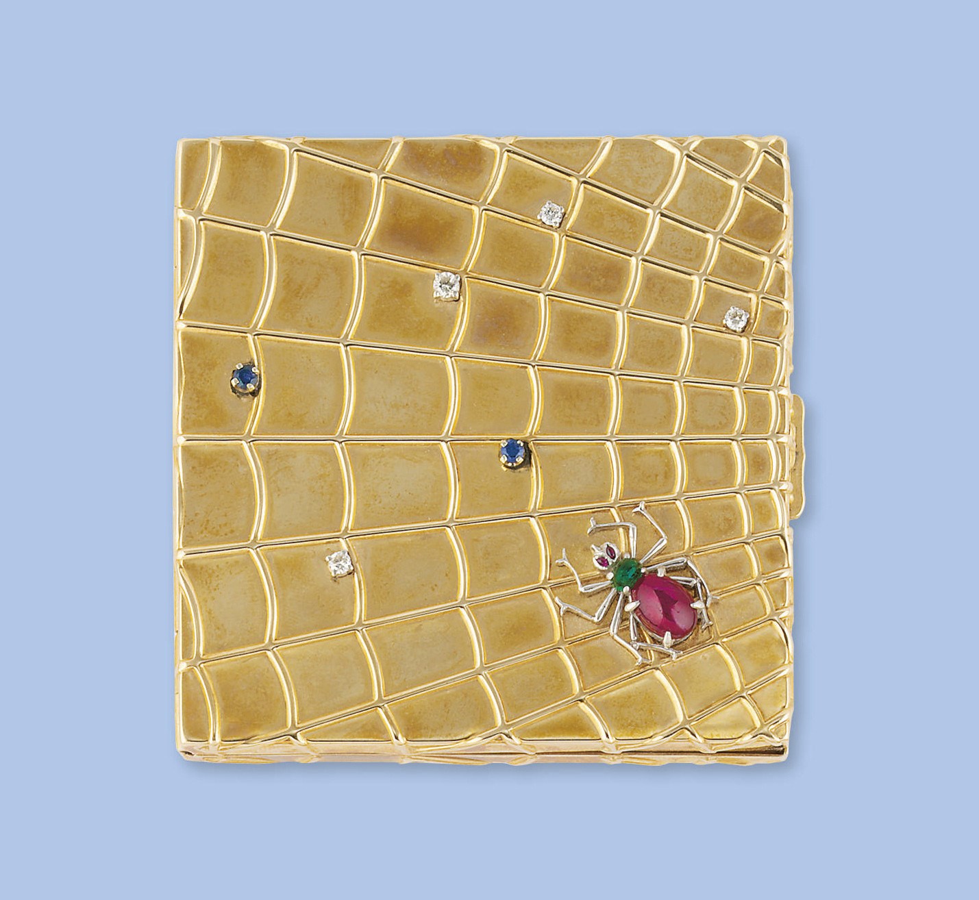 A gold and gem-set compact