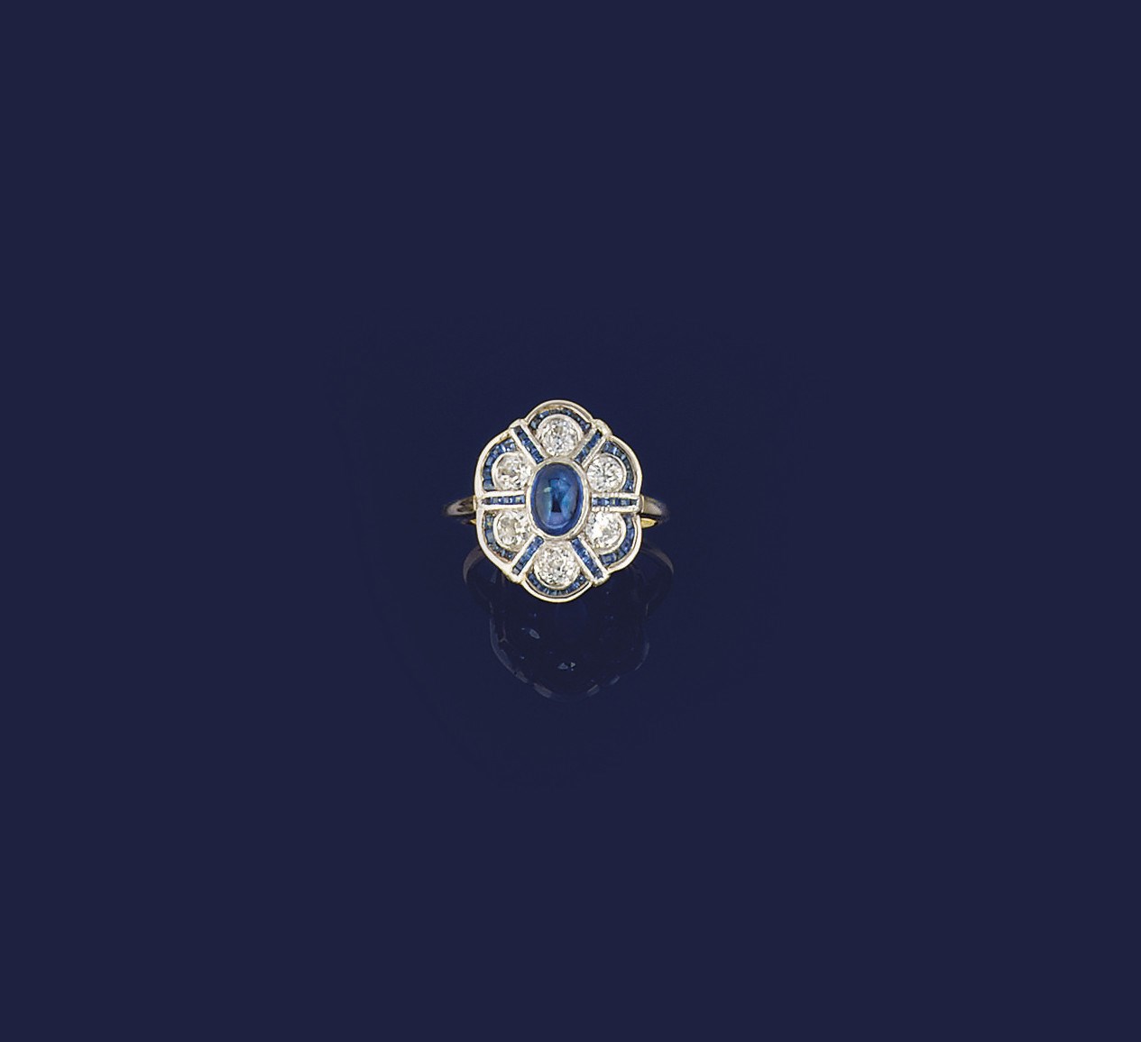 A sapphire and diamond cluster ring