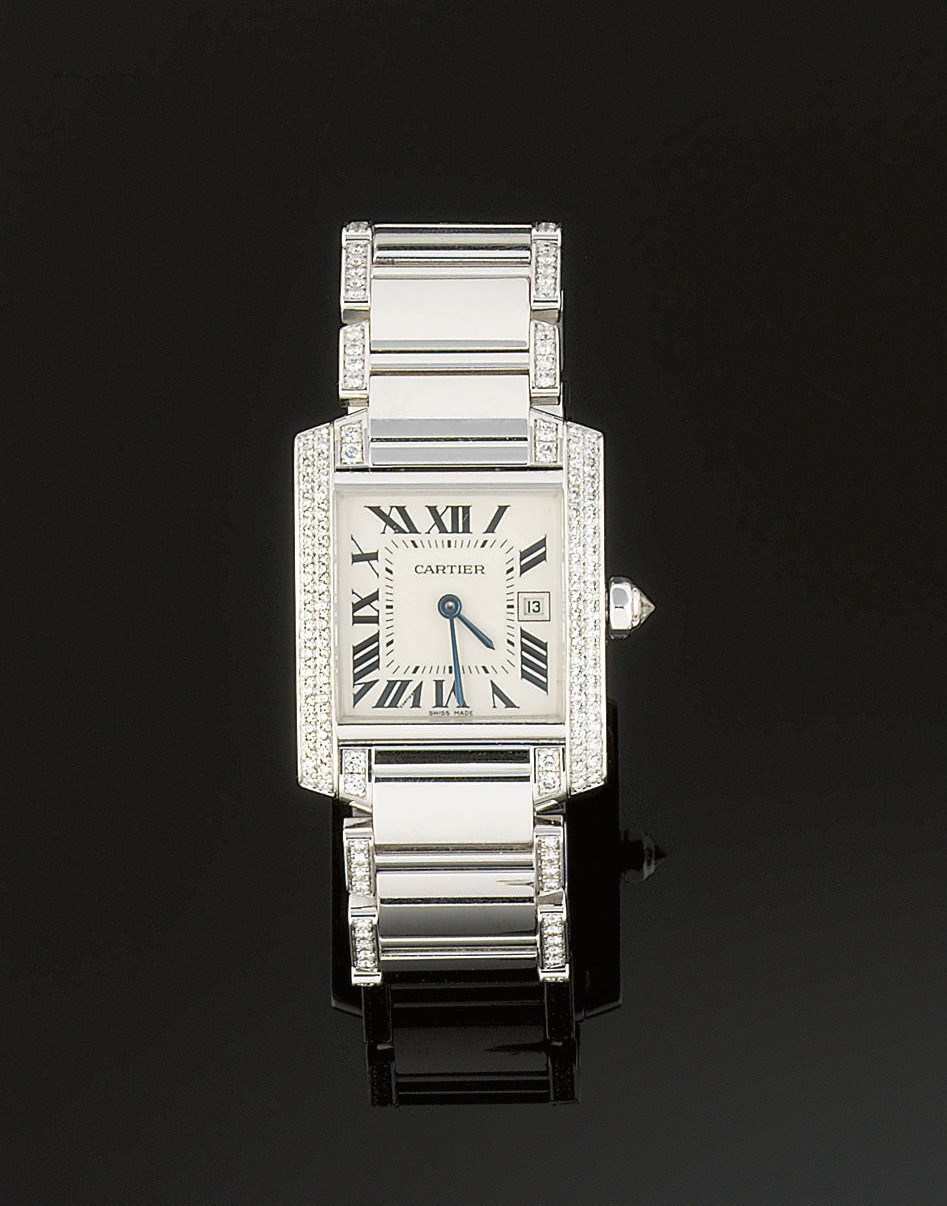A white gold and diamond "Tank" watch, by Cartier
